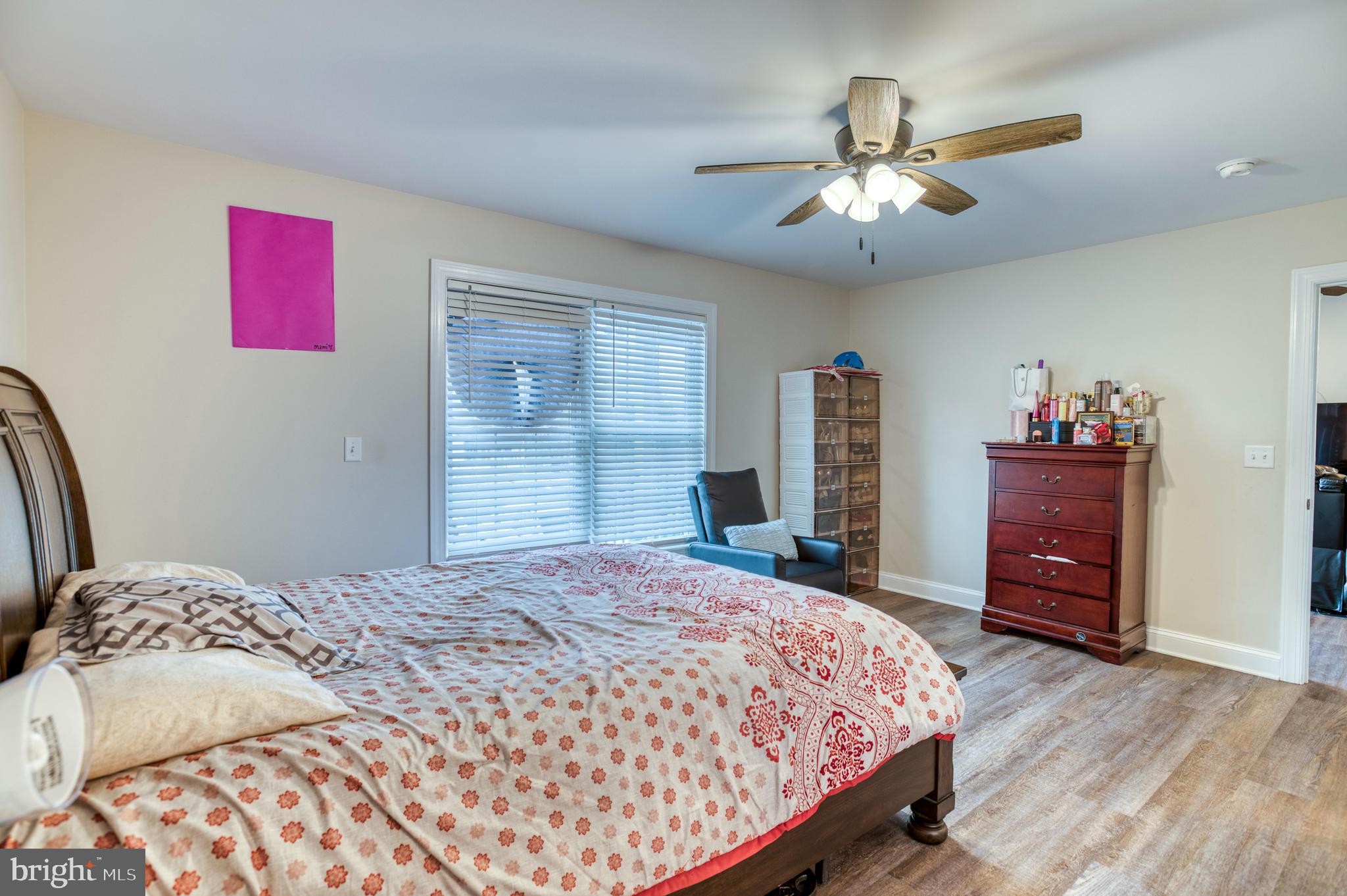 13084 Stonehouse Mountain Road Culpeper, VA 22701 - Photo 12 of 37 a bedroom with a bed and a dresser