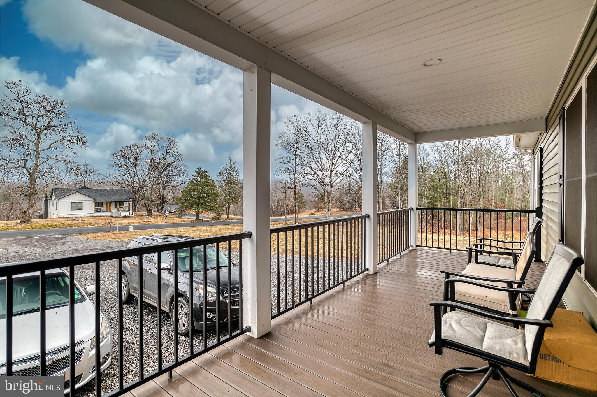 13084 Stonehouse Mountain Road Culpeper, VA 22701 - Photo 20 of 37 a view of a city from a balcony