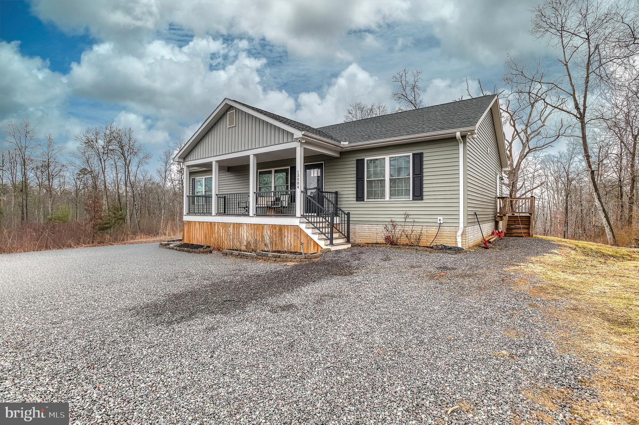 13084 Stonehouse Mountain Road Culpeper, VA 22701 - Photo 23 of 37 a view of house with backyard and trees