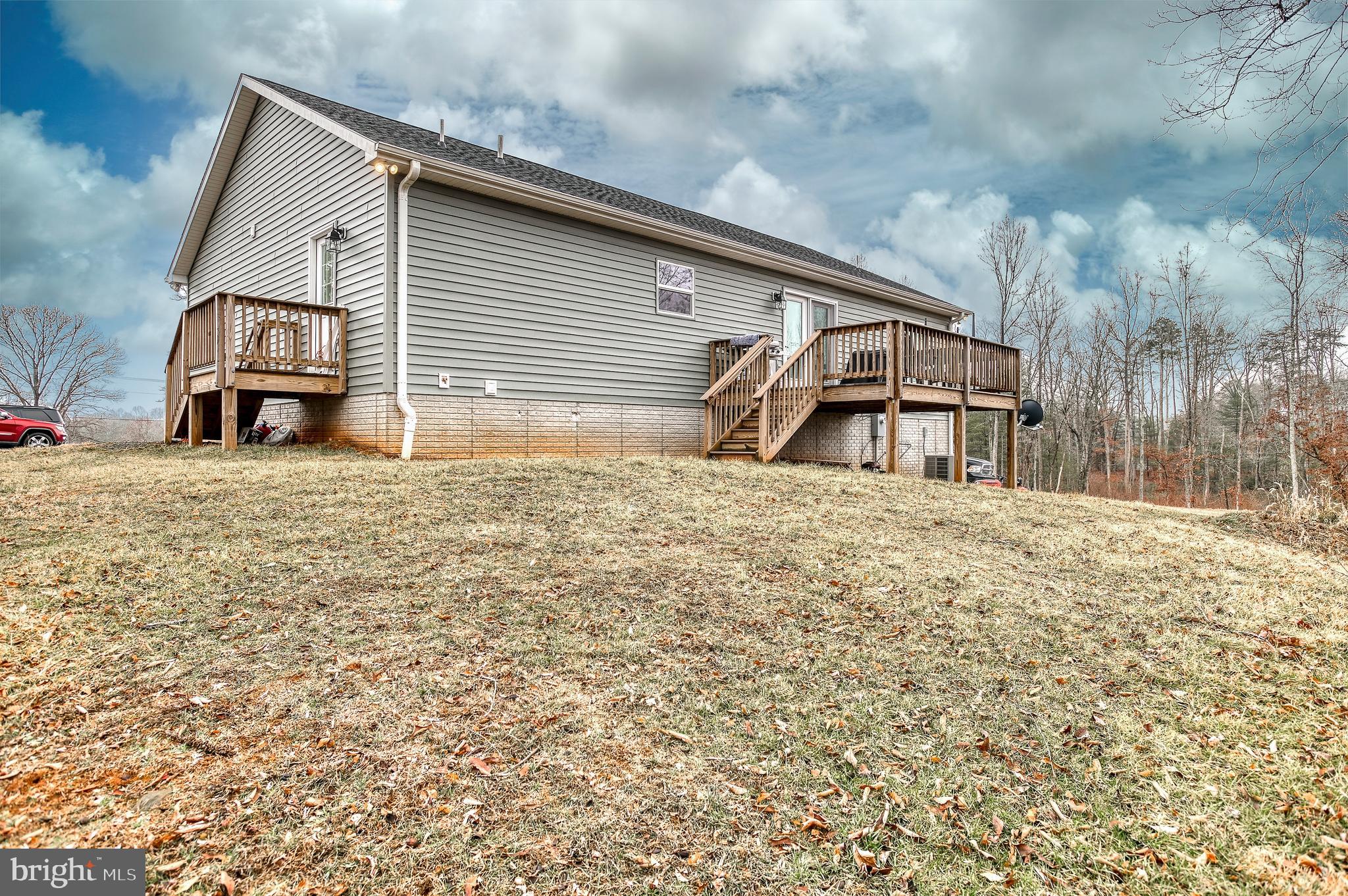 13084 Stonehouse Mountain Road Culpeper, VA 22701 - Photo 25 of 37 a house view with a backyard space