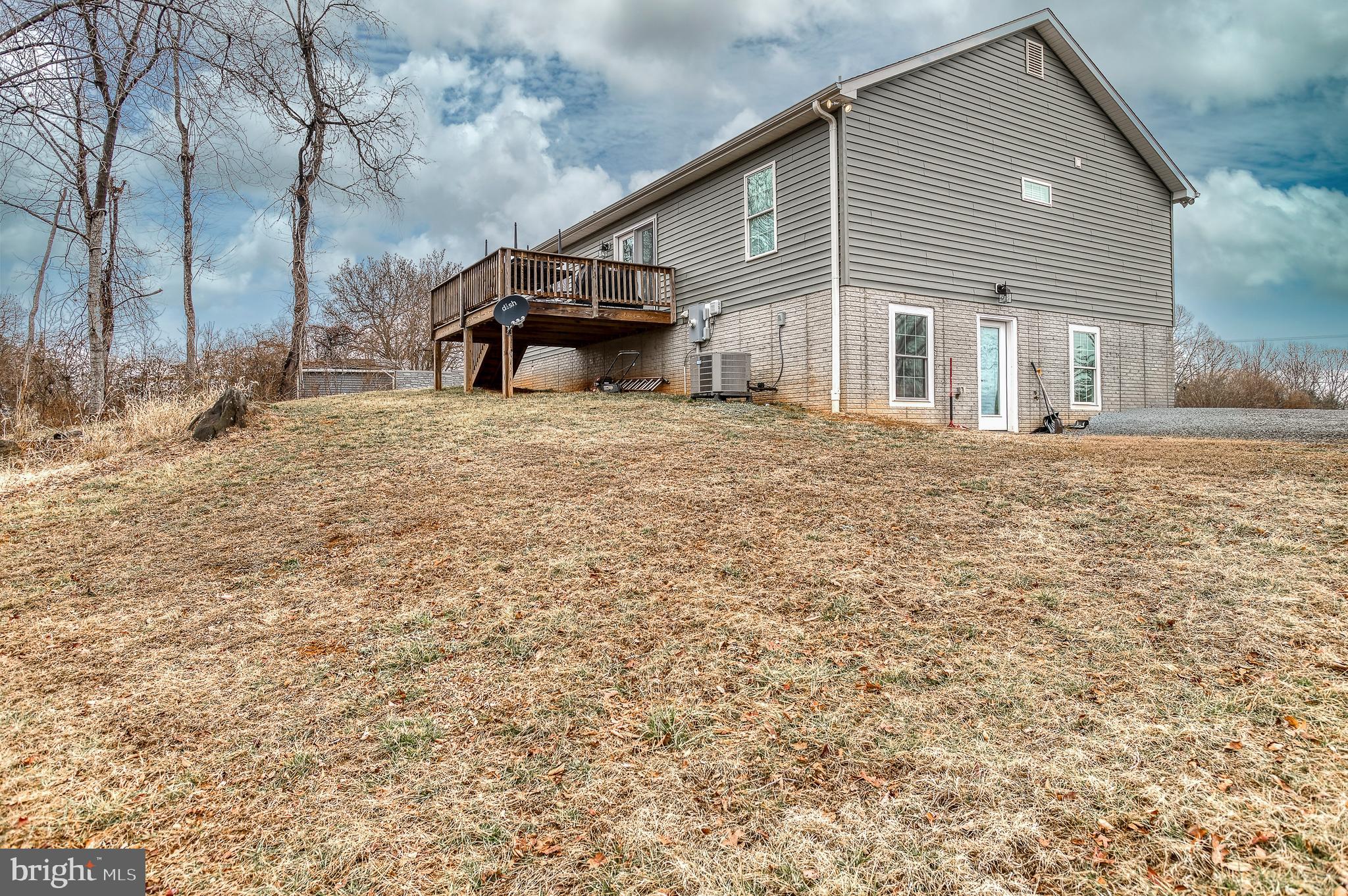 13084 Stonehouse Mountain Road Culpeper, VA 22701 - Photo 25 of 37 a front view of a house with a yard