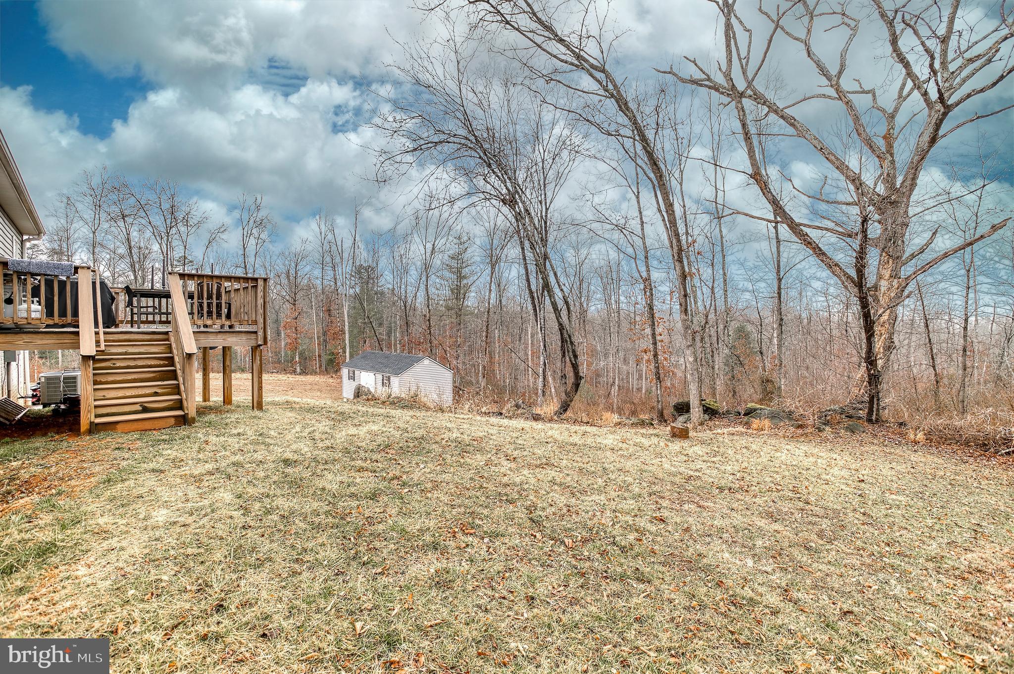 13084 Stonehouse Mountain Road Culpeper, VA 22701 - Photo 26 of 37 a big yard with large trees