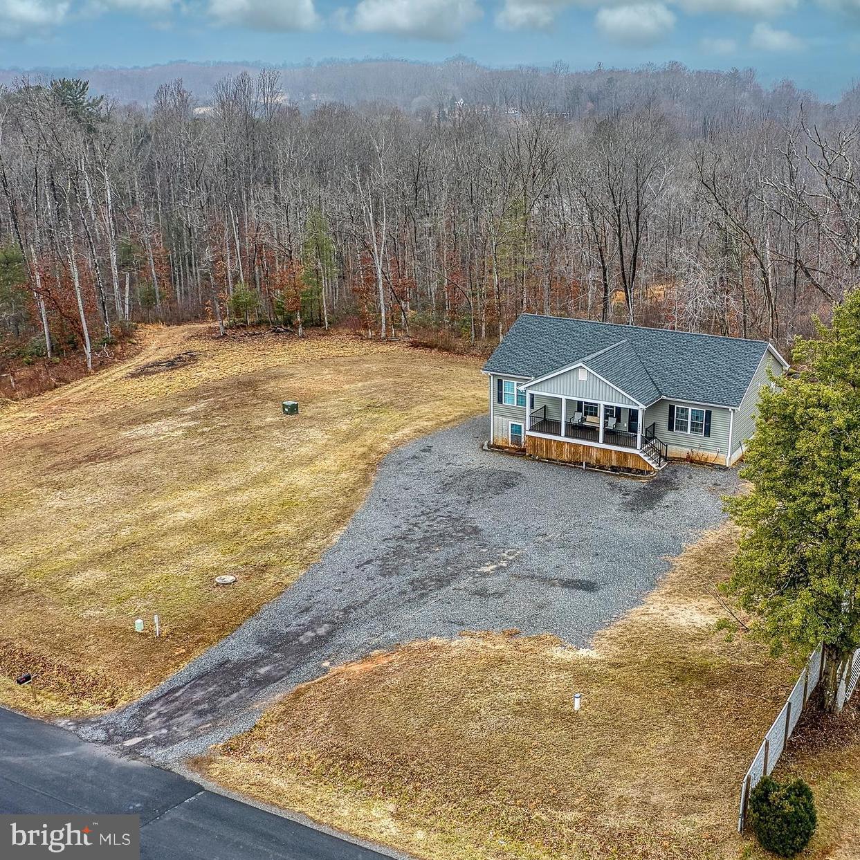 13084 Stonehouse Mountain Road Culpeper, VA 22701 - Photo 27 of 37 a view of a swimming pool with an outdoor space and seating area