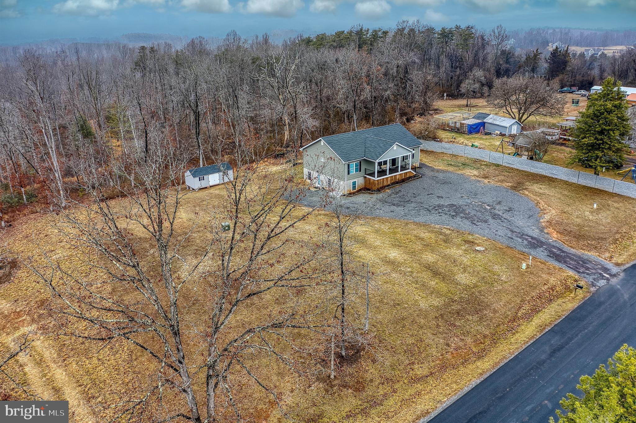 13084 Stonehouse Mountain Road Culpeper, VA 22701 - Photo 29 of 37 a view of a swimming pool with a yard
