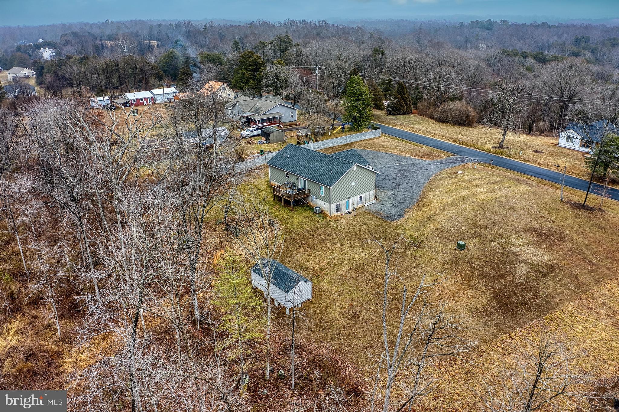 13084 Stonehouse Mountain Road Culpeper, VA 22701 - Photo 30 of 37 a view of a house with a yard