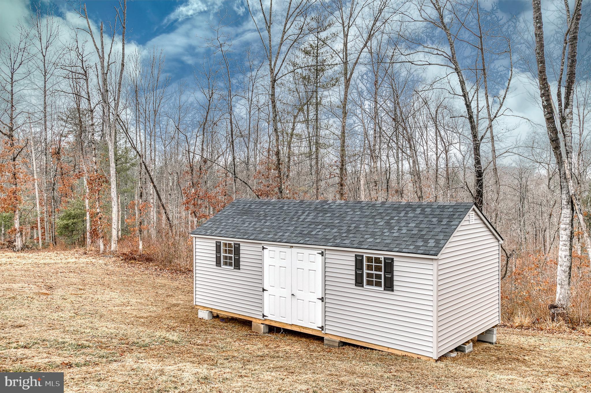13084 Stonehouse Mountain Road Culpeper, VA 22701 - Photo 37 of 37 a view of a house with a yard