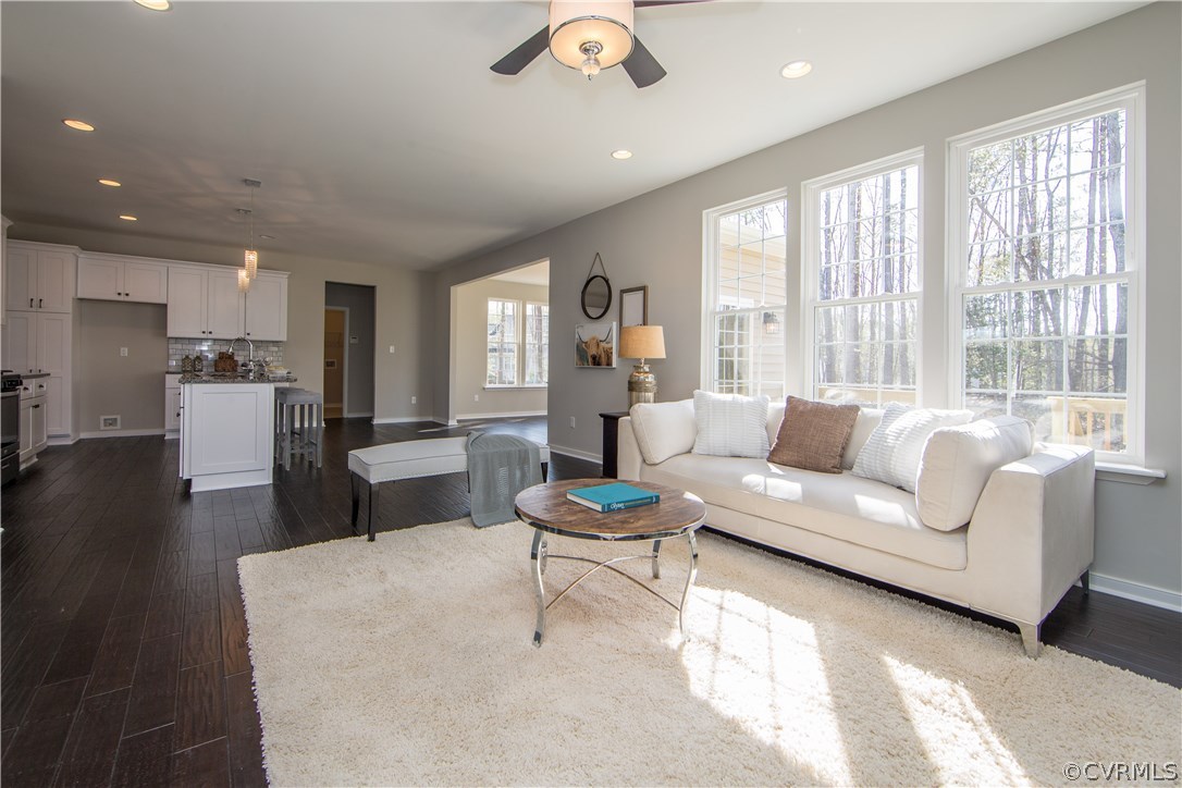 8955 Lavenham Loop Midlothian, VA 23112 - Photo 11 of 47 a living room with furniture and a large window