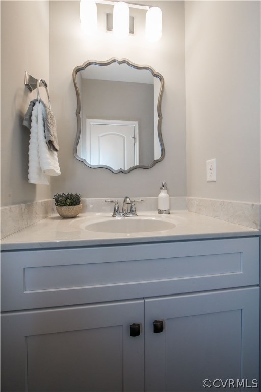 8955 Lavenham Loop Midlothian, VA 23112 - Photo 23 of 47 a bathroom with a sink vanity and mirror