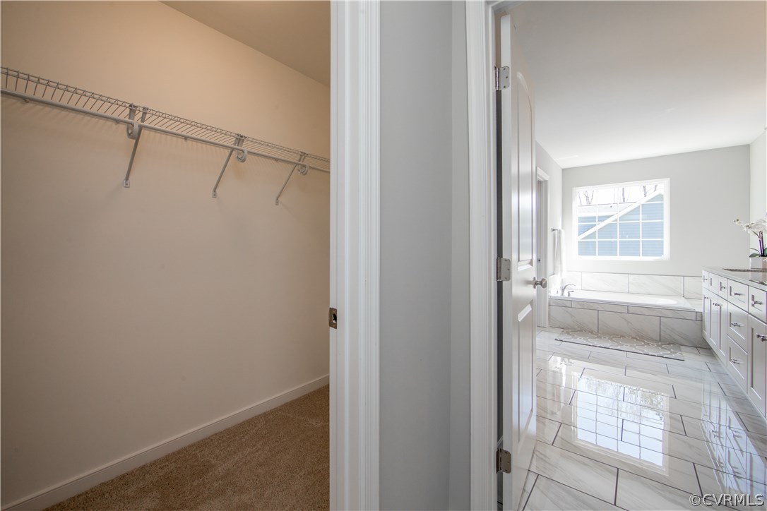 8955 Lavenham Loop Midlothian, VA 23112 - Photo 30 of 47 a view of walk in closet with window
