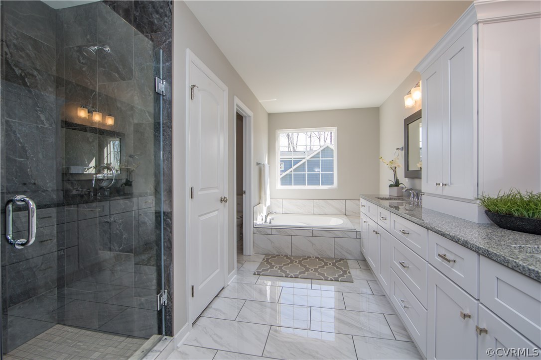 8955 Lavenham Loop Midlothian, VA 23112 - Photo 32 of 47 a bathroom with a granite countertop sink a toilet and shower