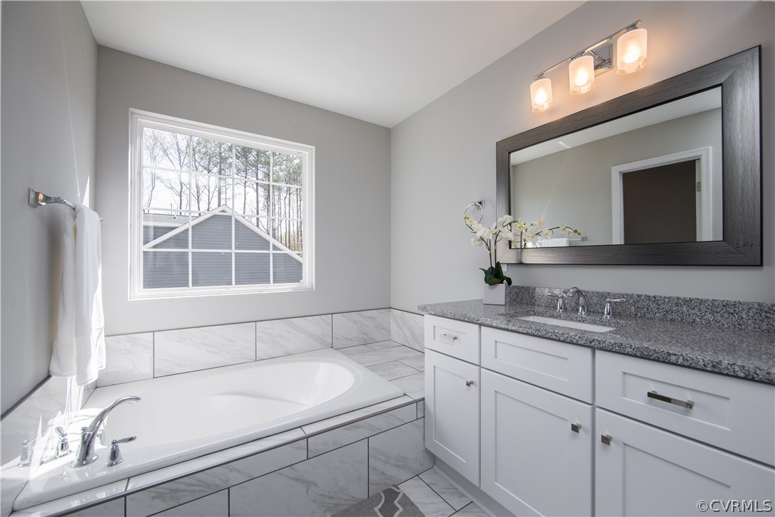 8955 Lavenham Loop Midlothian, VA 23112 - Photo 35 of 47 a bathroom with a sink and a bathtub