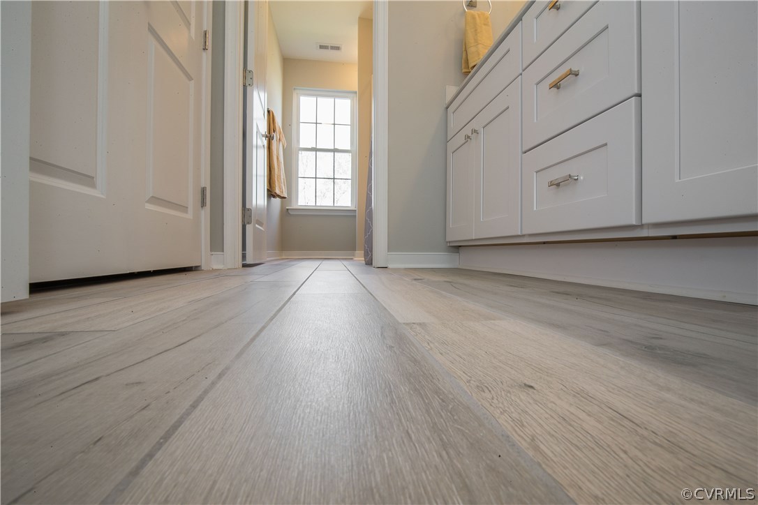8955 Lavenham Loop Midlothian, VA 23112 - Photo 41 of 47 a view of an empty room with wooden floor and a window