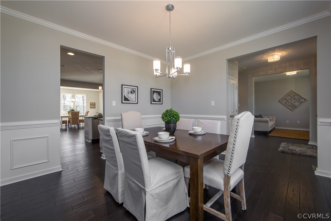 8955 Lavenham Loop Midlothian, VA 23112 - Photo 8 of 47 a view of a dining room with furniture and wooden floor