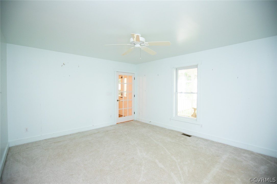 1771 Saw Mill Road Farmville, VA 23901 - Photo 21 of 48 an empty room with windows and ceiling fan