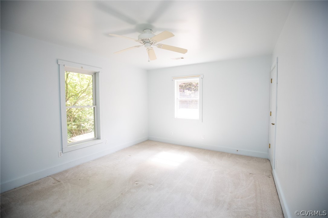 1771 Saw Mill Road Farmville, VA 23901 - Photo 26 of 48 an empty room with windows and fan