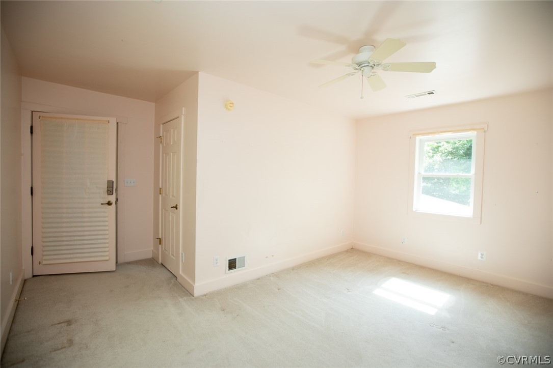 1771 Saw Mill Road Farmville, VA 23901 - Photo 28 of 48 an empty room with a ceiling fan and a window