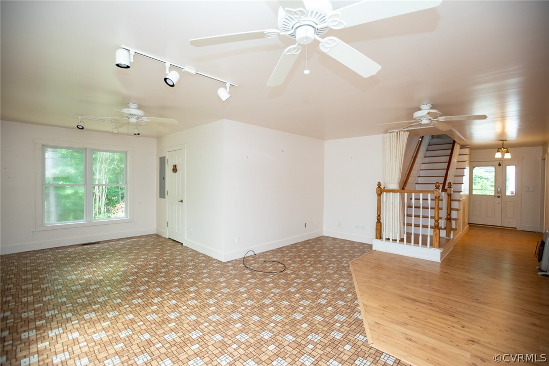 1771 Saw Mill Road Farmville, VA 23901 - Photo 9 of 48 an empty room with wooden floor fan and windows