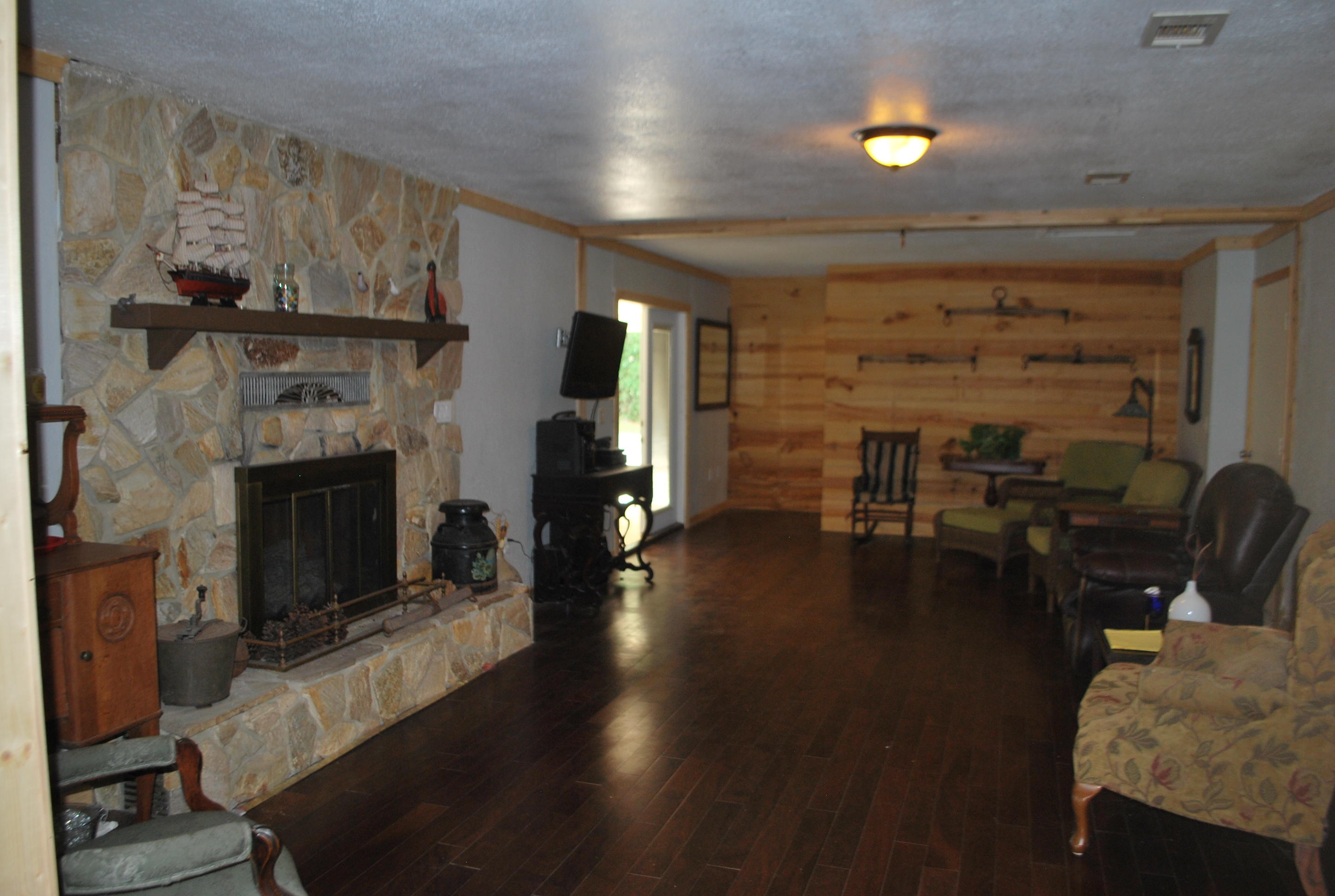 3602 Poverty Creek Road Crestview, FL 32539 - Photo 25 of 29 a living room with furniture and a fireplace