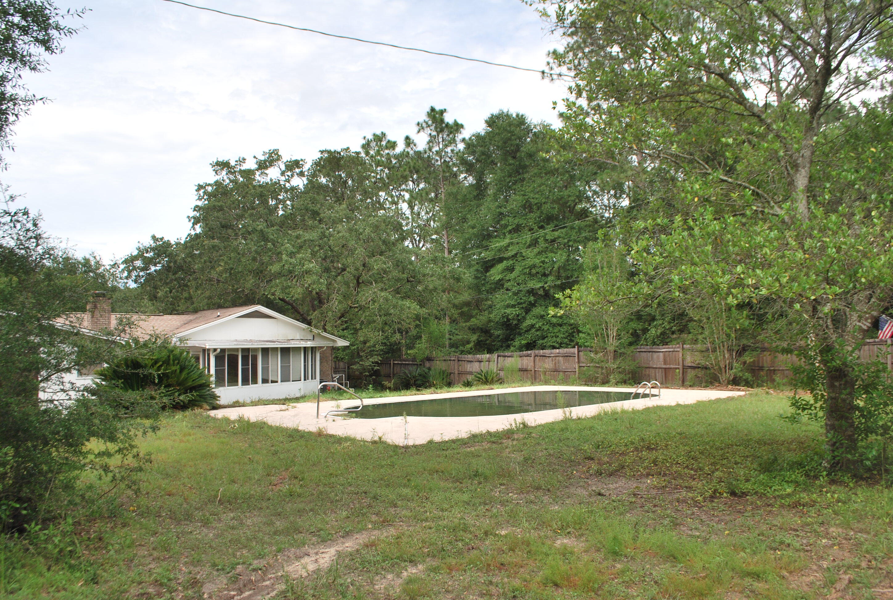 3602 Poverty Creek Road Crestview, FL 32539 - Photo 8 of 29 a front view of a house with a yard