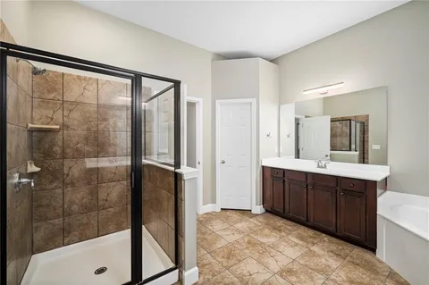 a bathroom with a bathtub and a sink