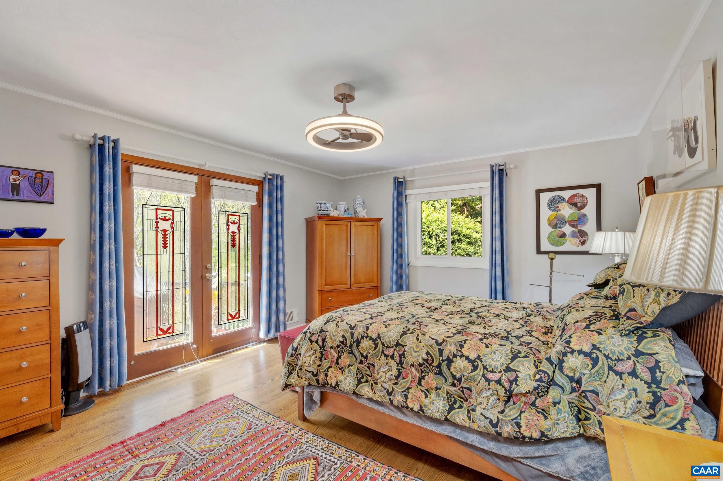 103 Powhatan Circle Charlottesville, VA 22901 - Photo 11 of 75 a bedroom with a bed and a dresser next to a window