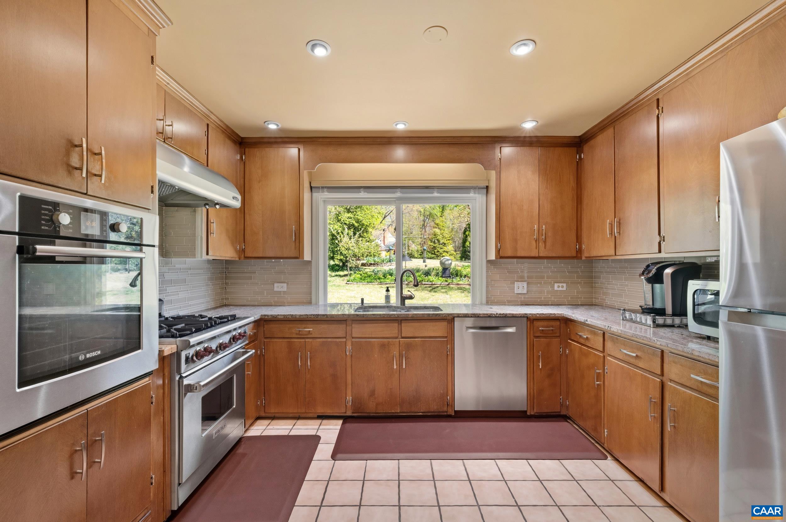 103 Powhatan Circle Charlottesville, VA 22901 - Photo 20 of 75 a kitchen with a sink stove top oven and cabinets