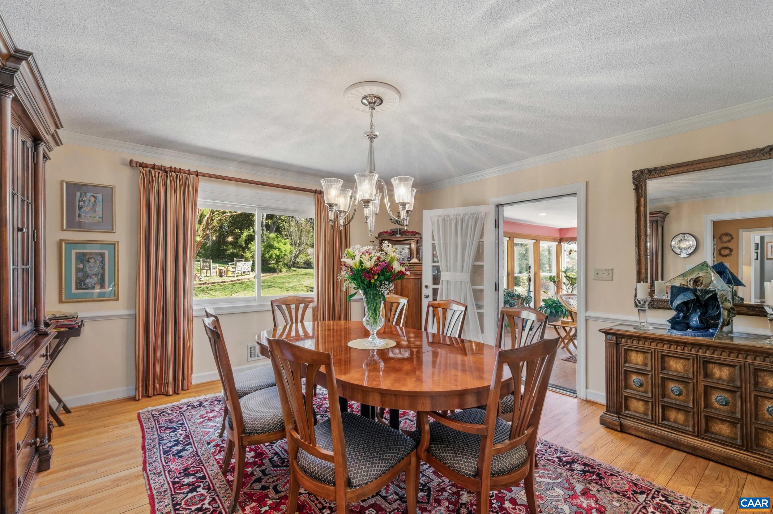 103 Powhatan Circle Charlottesville, VA 22901 - Photo 23 of 75 a view of a dining room with furniture window and outside view