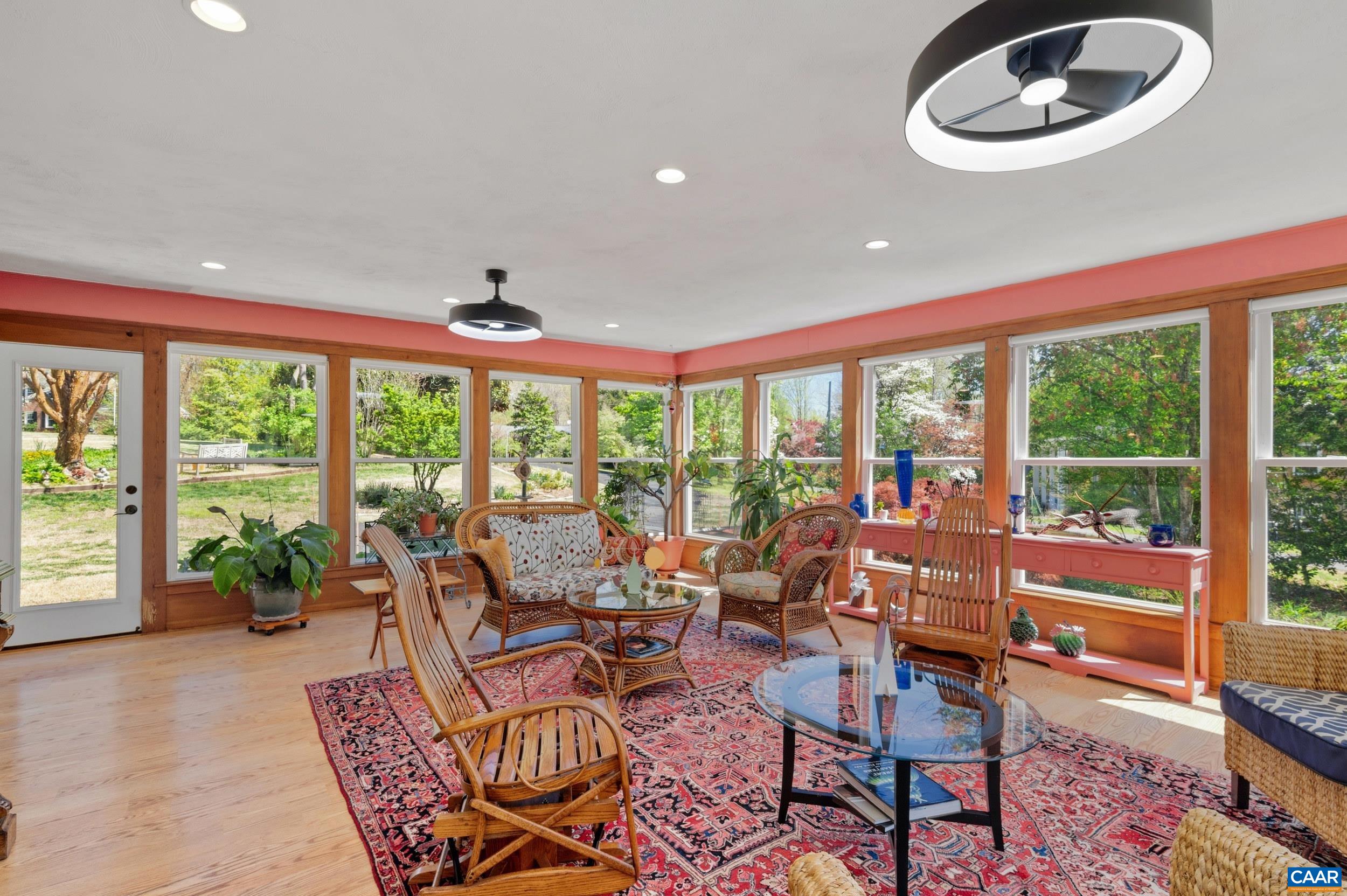 103 Powhatan Circle Charlottesville, VA 22901 - Photo 27 of 75 a living room with furniture and a floor to ceiling window