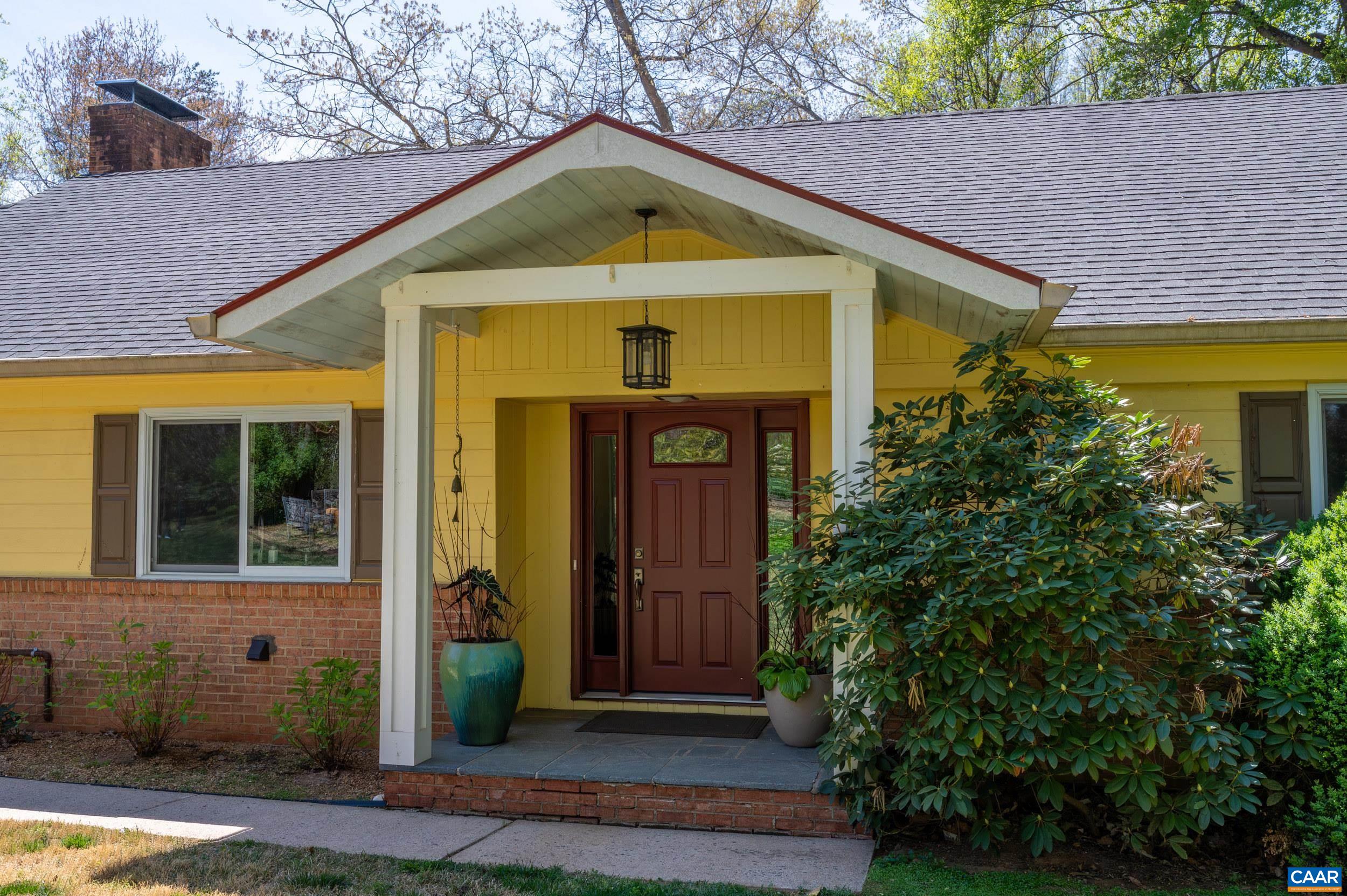 103 Powhatan Circle Charlottesville, VA 22901 - Photo 3 of 75 a front view of a house with garden