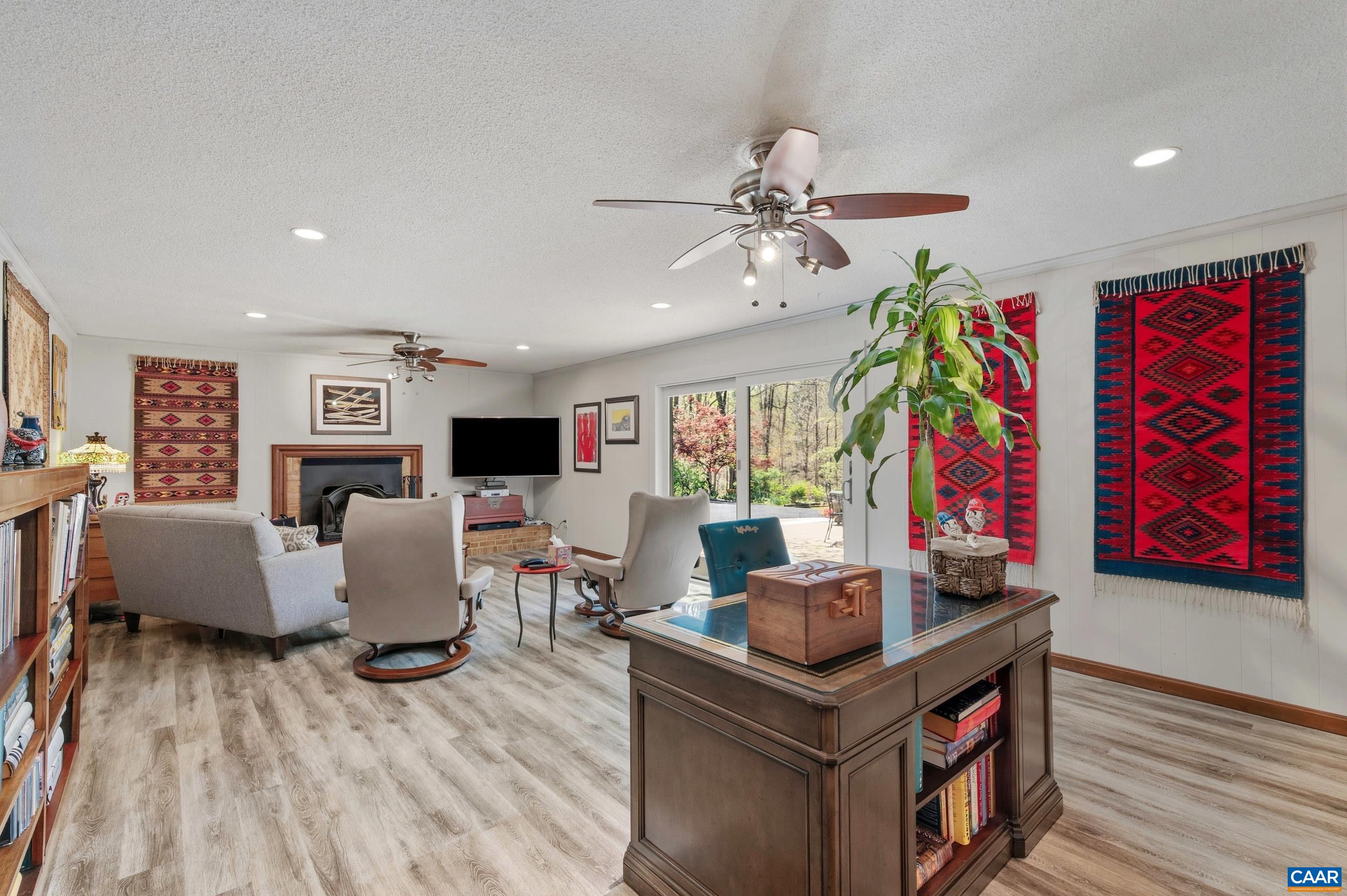 103 Powhatan Circle Charlottesville, VA 22901 - Photo 35 of 75 a living room with fireplace furniture and a flat screen tv