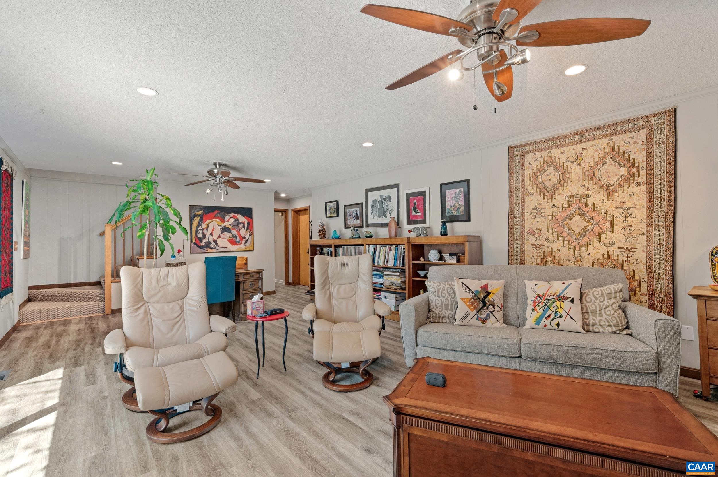 103 Powhatan Circle Charlottesville, VA 22901 - Photo 36 of 75 a living room with furniture and a flat screen tv