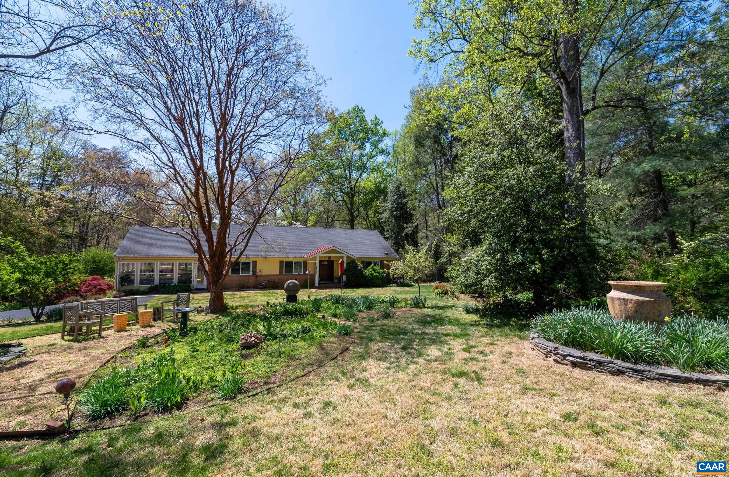 103 Powhatan Circle Charlottesville, VA 22901 - Photo 40 of 75 a front view of a house with a yard and a large tree