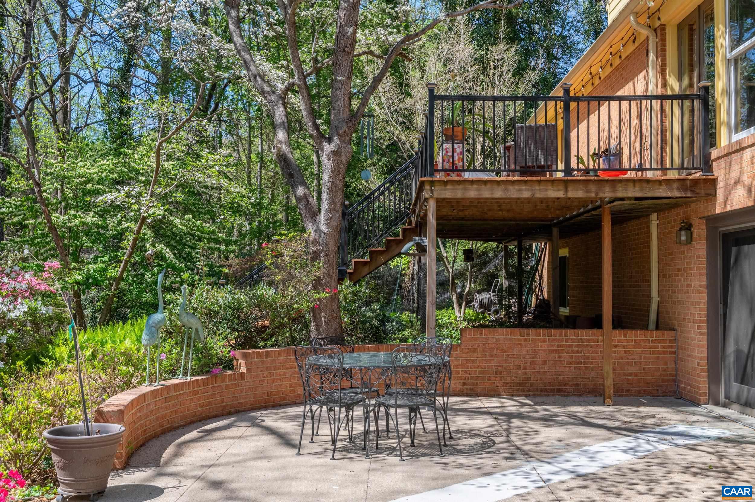 103 Powhatan Circle Charlottesville, VA 22901 - Photo 49 of 75 a view of a patio with table and chairs and potted plants