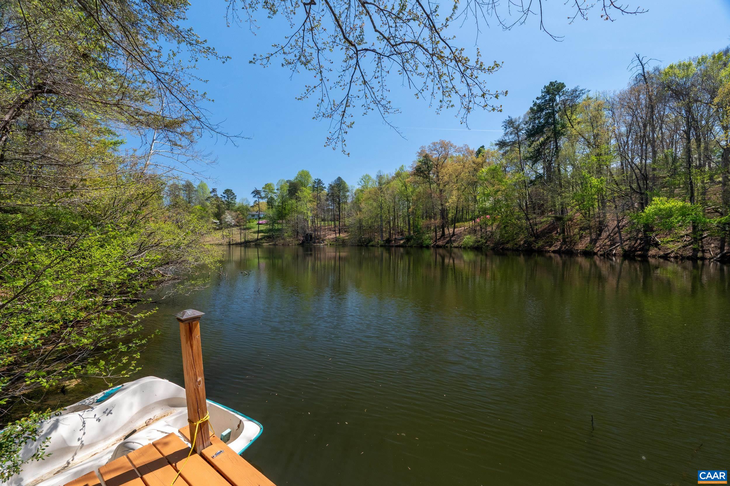 103 Powhatan Circle Charlottesville, VA 22901 - Photo 63 of 75 a view of a lake with a mountain in the background