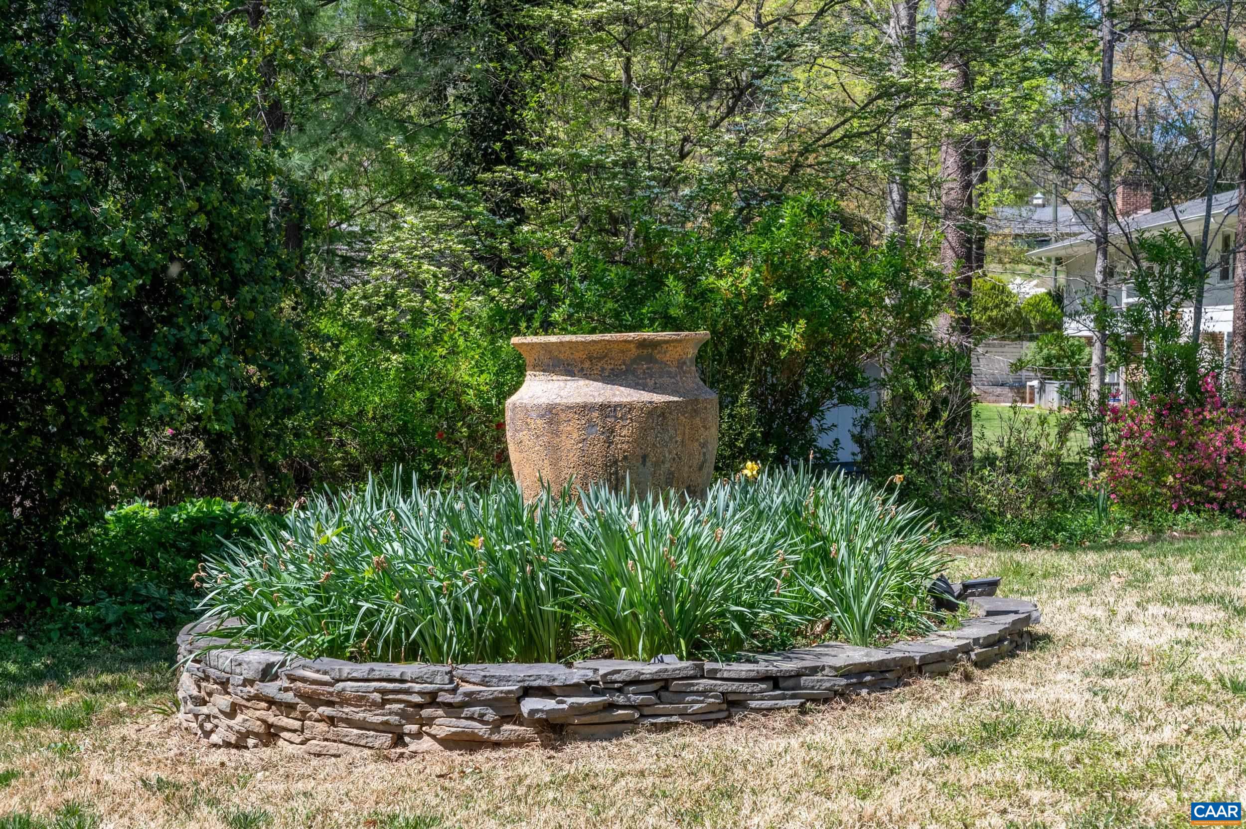103 Powhatan Circle Charlottesville, VA 22901 - Photo 66 of 75 a view of a garden with a fountain