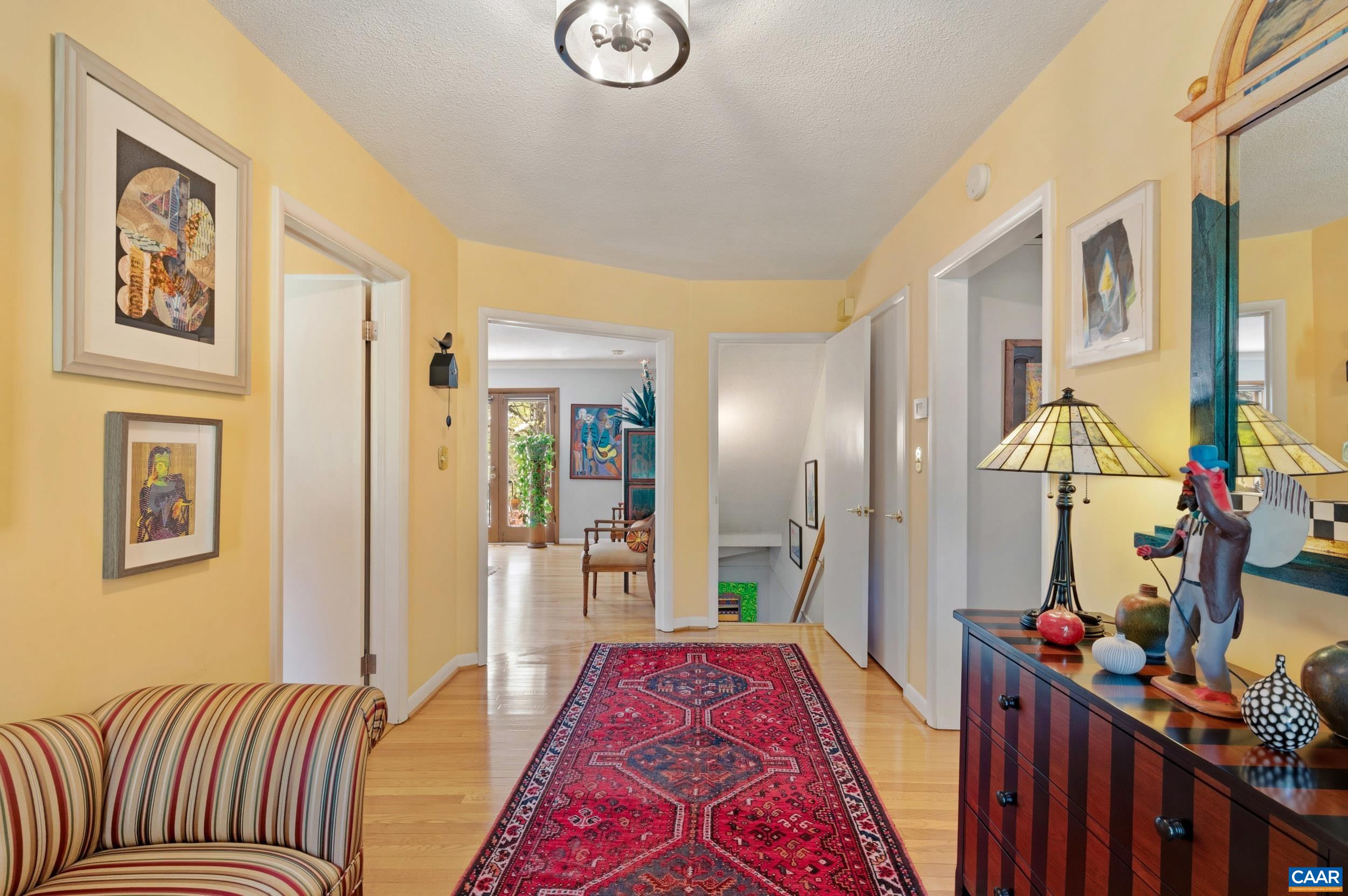103 Powhatan Circle Charlottesville, VA 22901 - Photo 7 of 75 a bed room with a bed painting on wall and two windows
