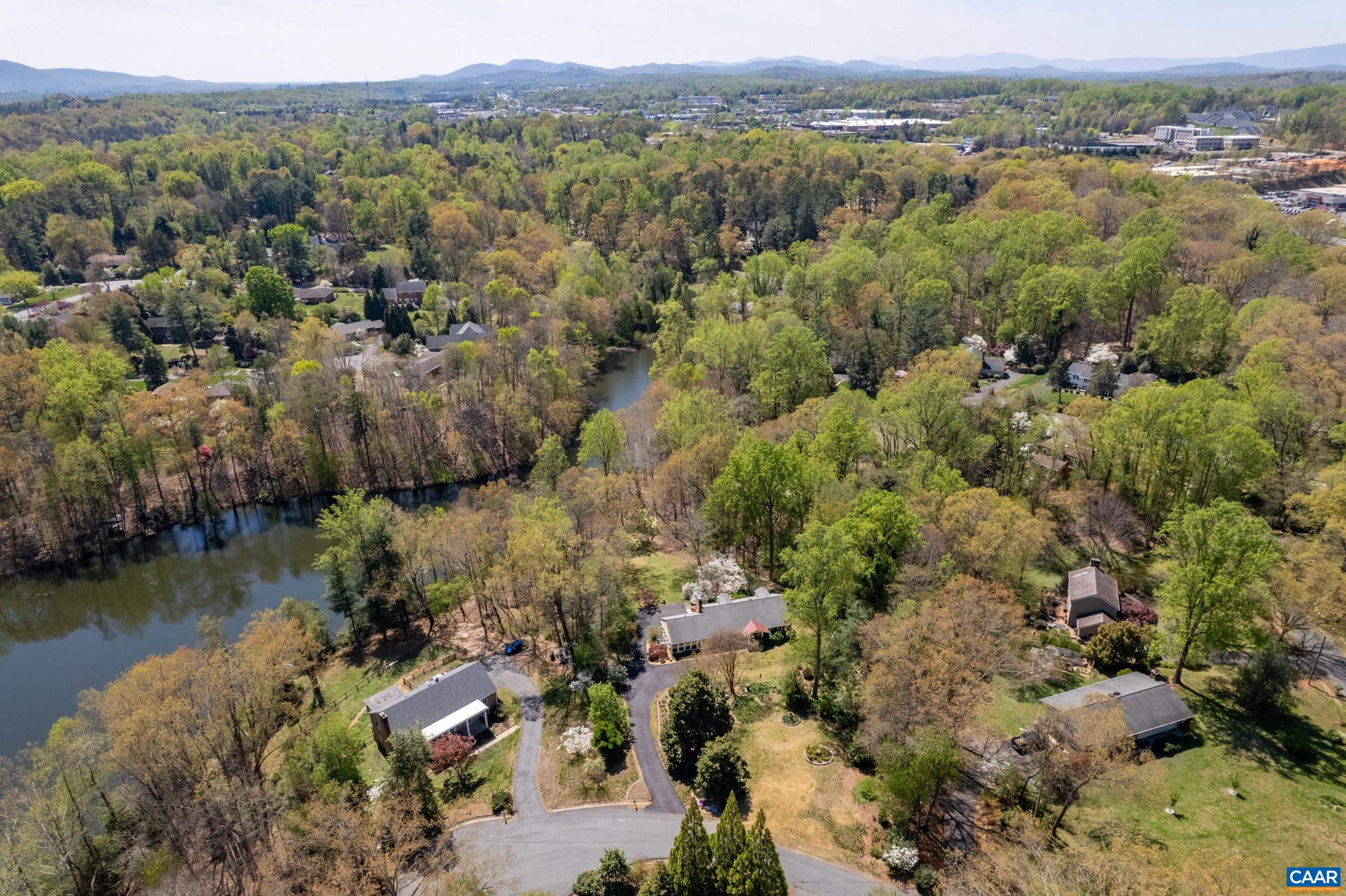 103 Powhatan Circle Charlottesville, VA 22901 - Photo 71 of 75 an aerial view of a house with a yard and lake view