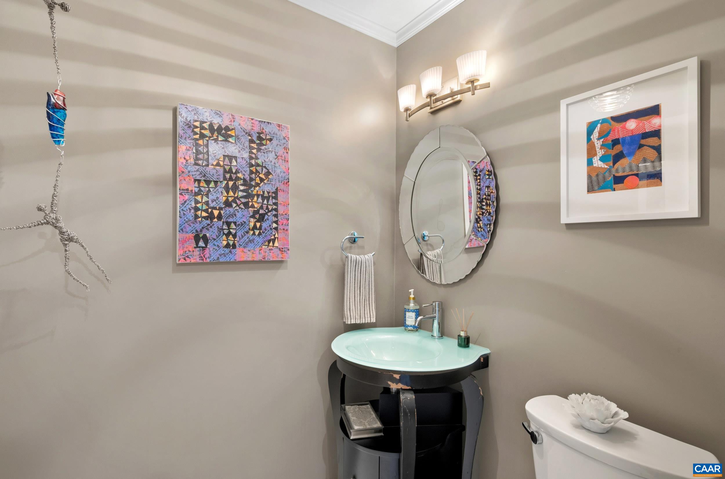 103 Powhatan Circle Charlottesville, VA 22901 - Photo 10 of 75 a bathroom with a toilet a sink and a mirror
