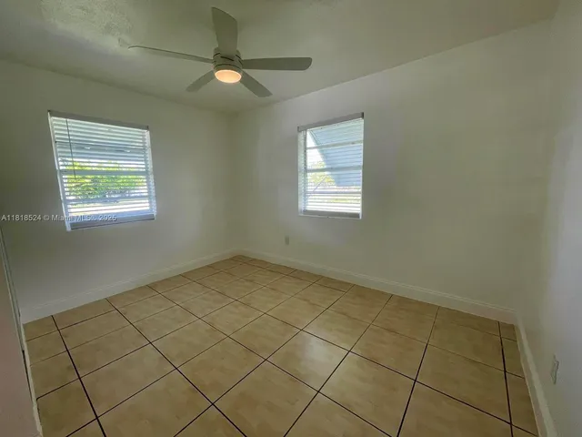 a view of an empty room and window