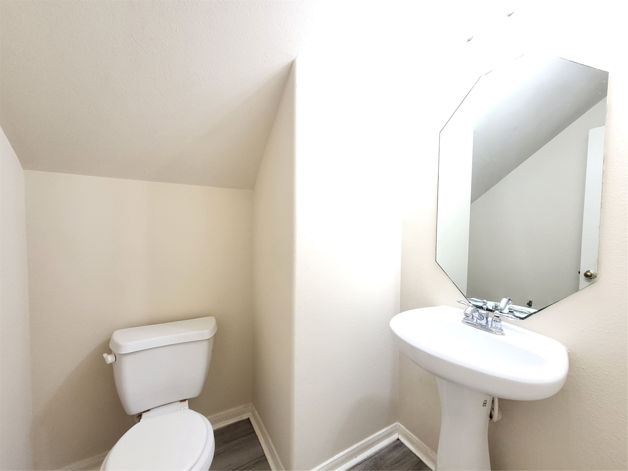 14034 Maximos Drive Houston, TX 77083 - Photo 13 of 27 a bathroom with a toilet sink and mirror