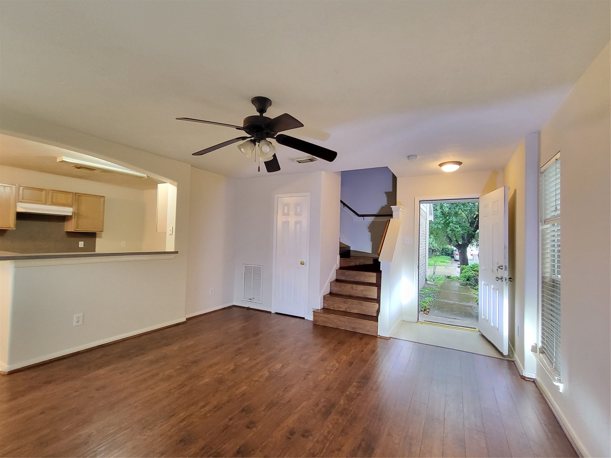 14034 Maximos Drive Houston, TX 77083 - Photo 16 of 27 a view of entryway and kitchen with wooden floor