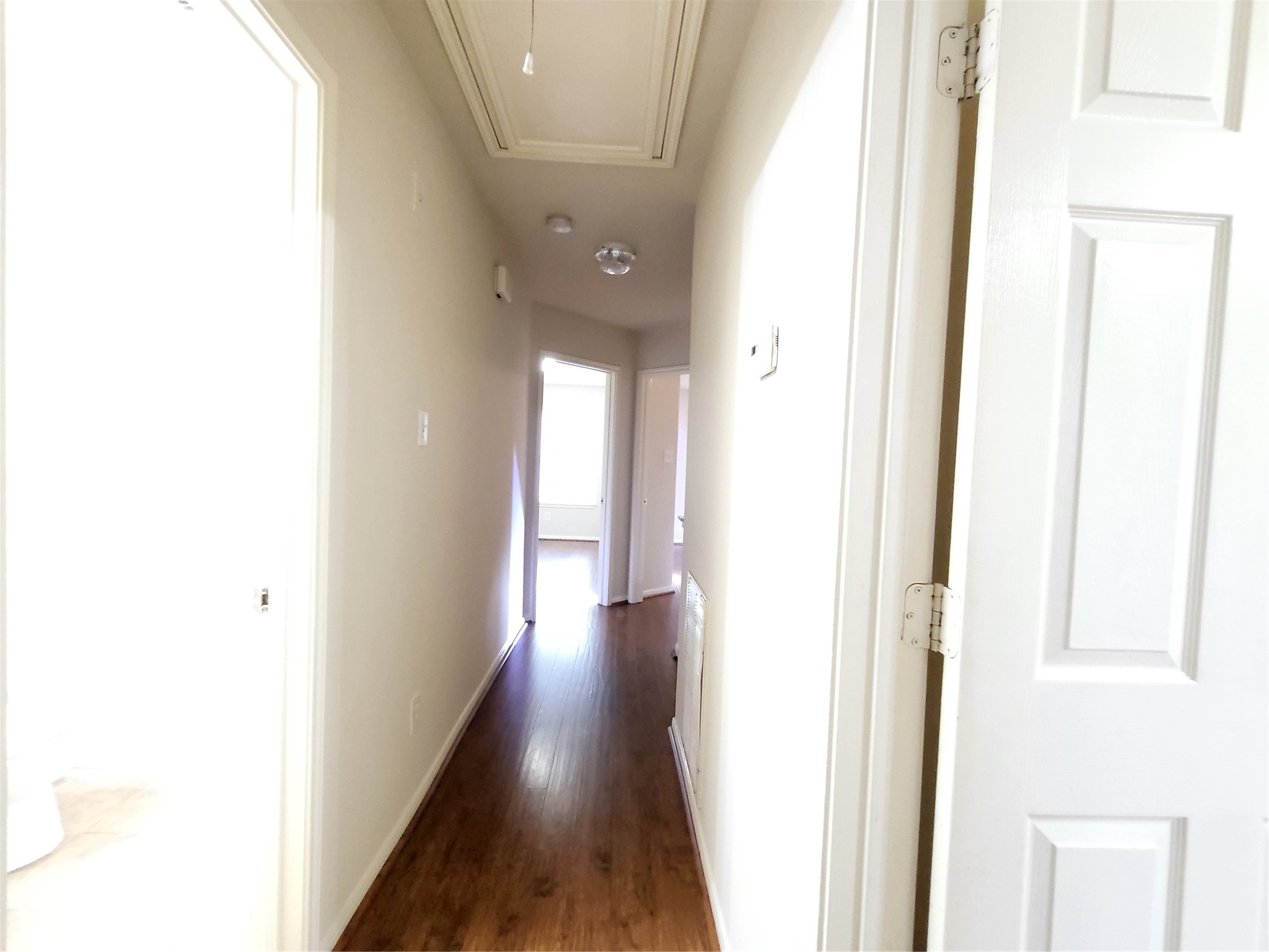 14034 Maximos Drive Houston, TX 77083 - Photo 18 of 27 a view of a hallway with wooden floor