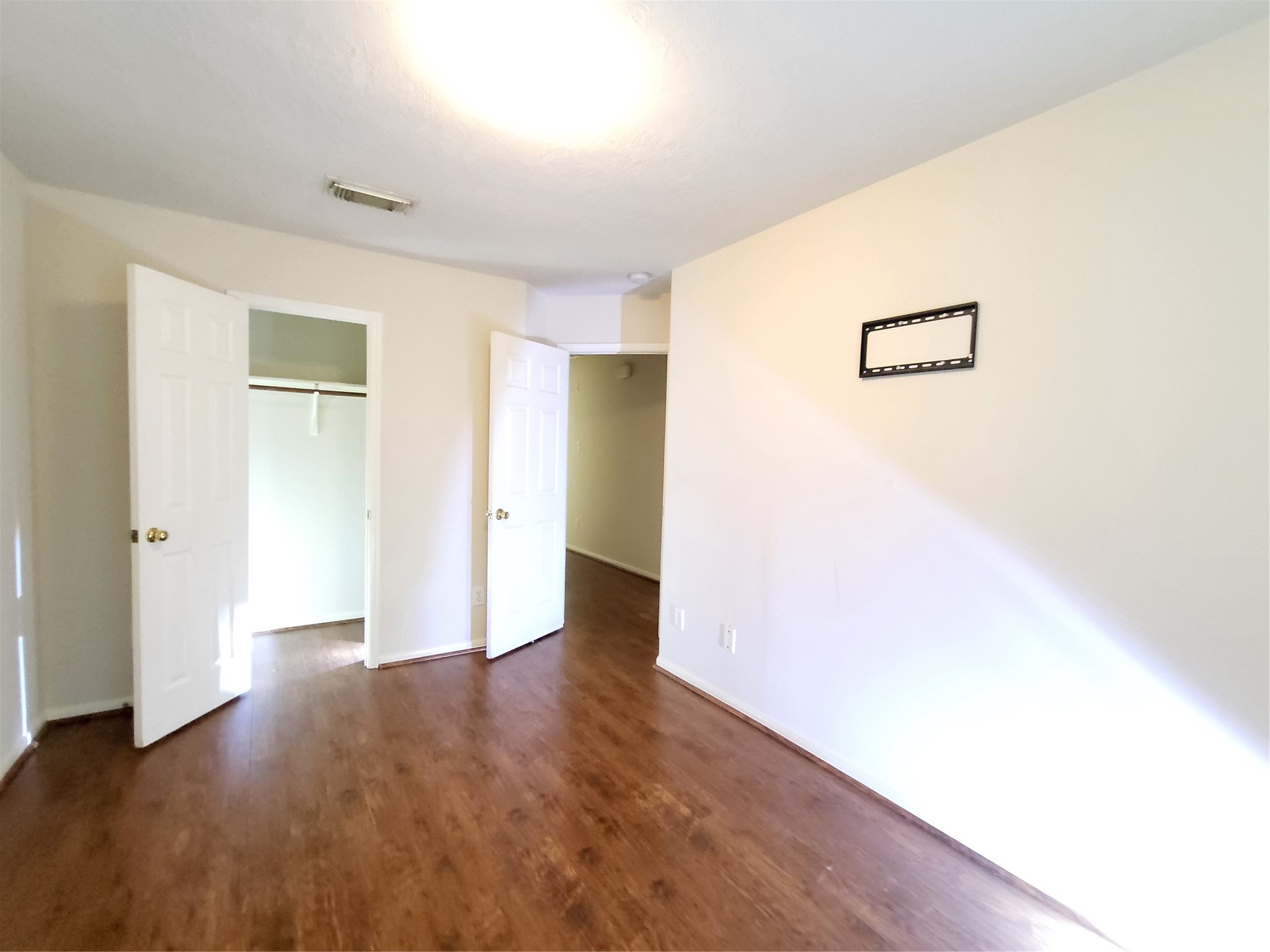 14034 Maximos Drive Houston, TX 77083 - Photo 23 of 27 a view of a big room with wooden floor and windows