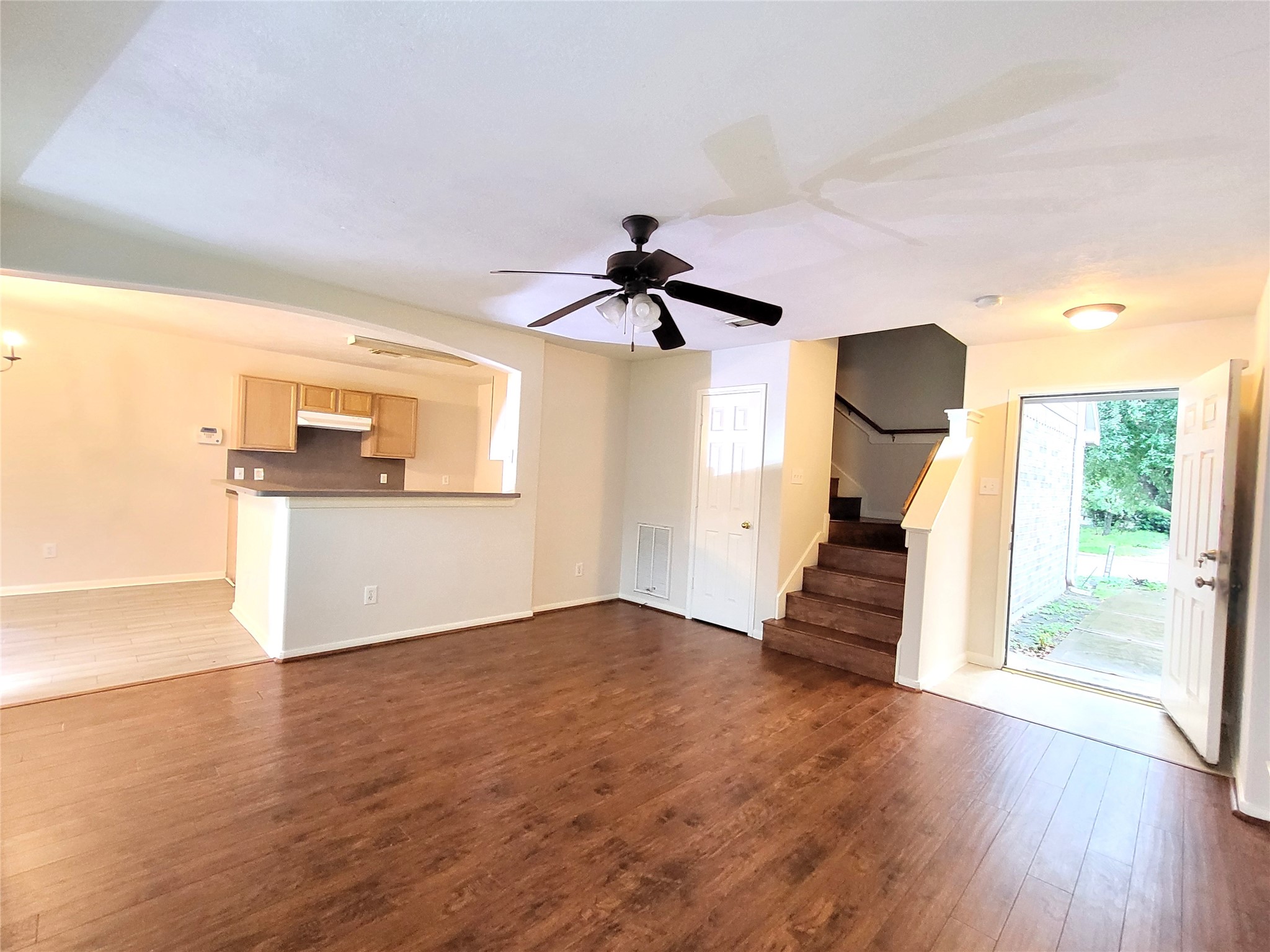 14034 Maximos Drive Houston, TX 77083 - Photo 4 of 27 a view of empty room with wooden floor and window