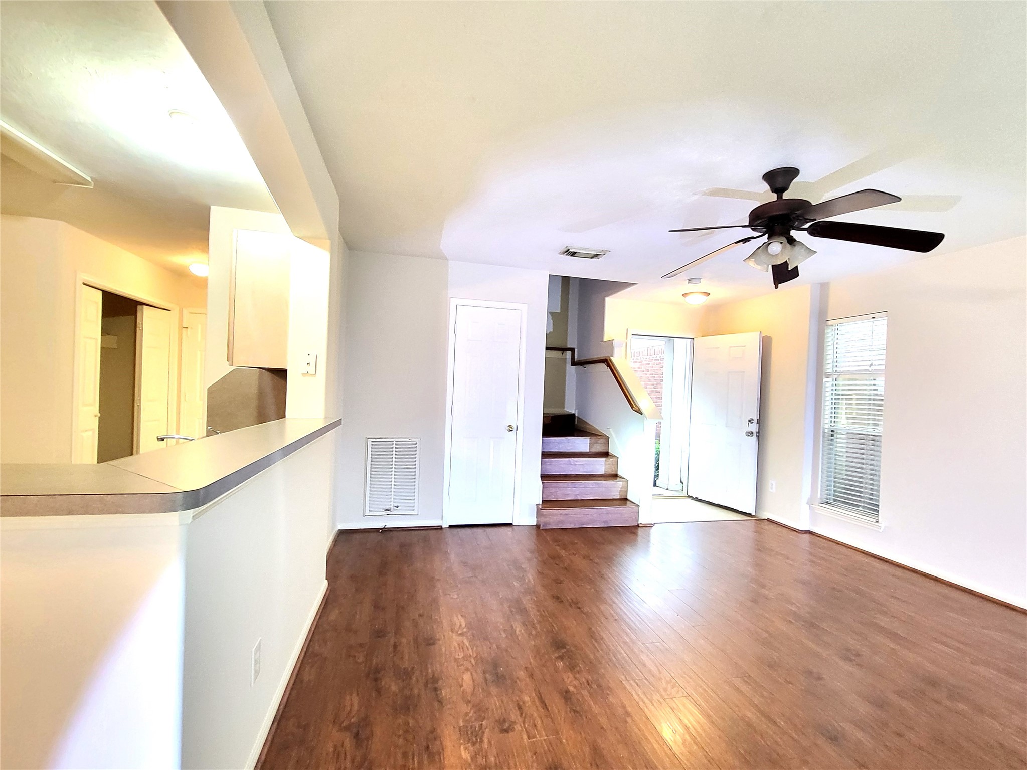 14034 Maximos Drive Houston, TX 77083 - Photo 8 of 27 a view of entryway and hall with wooden floor