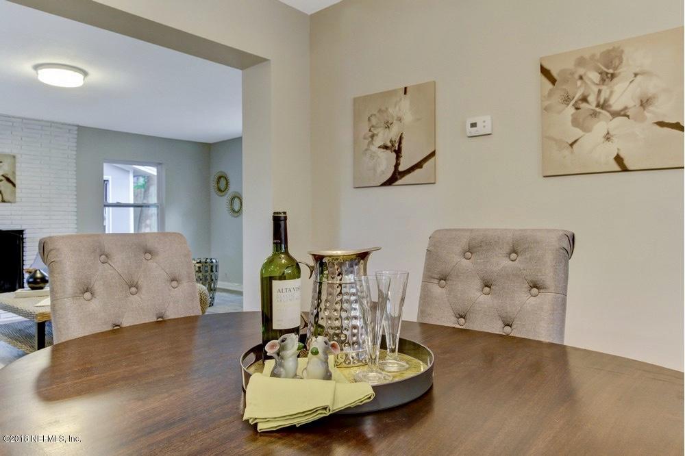 6815 Heidi Road Jacksonville, FL 32277 - Photo 11 of 36 a living room with furniture and a wooden floor