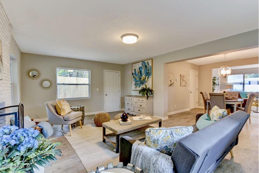 6815 Heidi Road Jacksonville, FL 32277 - Photo 18 of 36 a living room with furniture and wooden floor