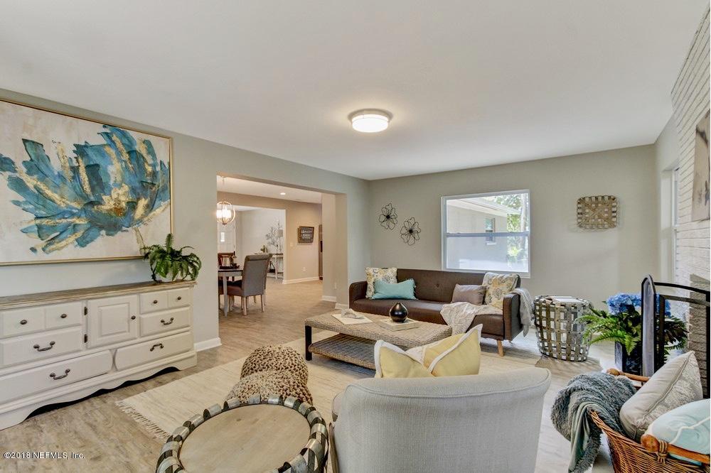 6815 Heidi Road Jacksonville, FL 32277 - Photo 20 of 36 a living room with furniture and wooden floor