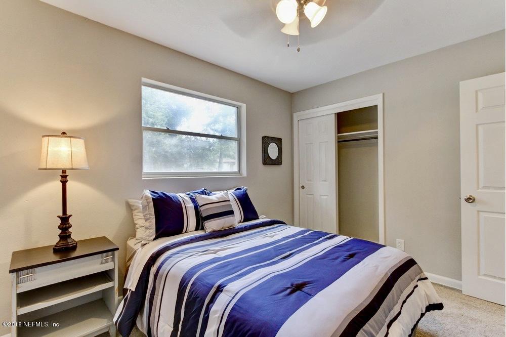 6815 Heidi Road Jacksonville, FL 32277 - Photo 25 of 36 a bedroom with bed and a window