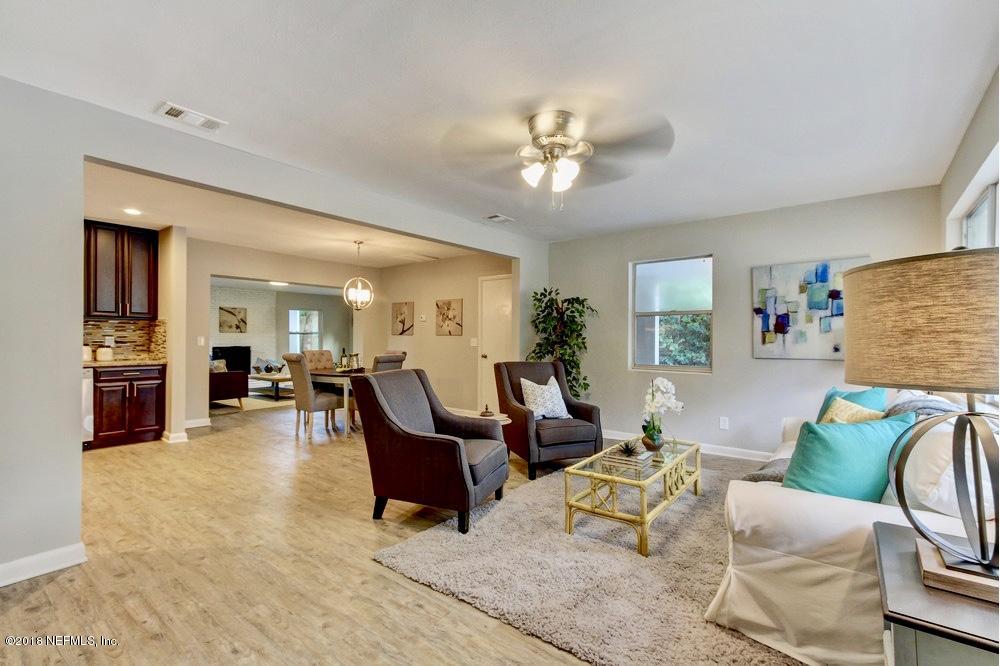 6815 Heidi Road Jacksonville, FL 32277 - Photo 3 of 36 a living room with furniture and wooden floor